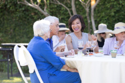 folks enjoying wine at a table together